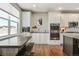 Gourmet kitchen boasts stainless steel appliances, custom cabinets, and hardwood floors at 31353 E 163Rd Ave, Hudson, CO 80642