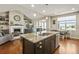 Spacious kitchen island with granite countertops, stainless steel appliances, and hardwood floors at 31353 E 163Rd Ave, Hudson, CO 80642