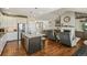 Open concept living area with hardwood floors, high ceilings, and a fireplace at 31353 E 163Rd Ave, Hudson, CO 80642