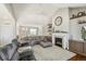Inviting living room featuring a cozy fireplace and comfortable seating at 31353 E 163Rd Ave, Hudson, CO 80642