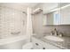 The bathroom showcases subway tile surround and granite vanity for a spa-like experience at 1029 E 8Th Ave # 1302, Denver, CO 80218