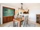 Open dining room features a built-in bar and modern light fixture, perfect for entertaining guests at 1029 E 8Th Ave # 1302, Denver, CO 80218