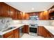 Updated kitchen featuring stainless steel appliances, granite countertops and ample cabinet space at 1029 E 8Th Ave # 1302, Denver, CO 80218
