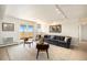 Comfortable living room offers ample seating, balcony access, and stylish nautical decor at 1029 E 8Th Ave # 1302, Denver, CO 80218