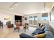 Bright living room featuring modern decor, balcony access, and city views at 1029 E 8Th Ave # 1302, Denver, CO 80218