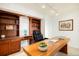 The office features custom wood built-ins with an executive desk for a luxurious workspace at 1029 E 8Th Ave # 1302, Denver, CO 80218