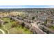 Overhead shot of community with well-maintained townhomes, mature trees, and a pool with tennis court at 8755 W Cornell Ave # 14-5, Lakewood, CO 80227