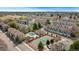 Aerial of townhomes with a tennis court and swimming pool, offering a serene and active lifestyle at 8755 W Cornell Ave # 14-5, Lakewood, CO 80227