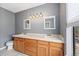 Well-lit bathroom featuring a double vanity and tile flooring at 8755 W Cornell Ave # 14-5, Lakewood, CO 80227