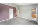 Cozy bedroom with neutral carpeting and access to an en-suite bathroom at 8755 W Cornell Ave # 14-5, Lakewood, CO 80227