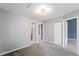 Neutral bedroom with soft carpet, ample closet space, and multiple doorways for versatile access at 8755 W Cornell Ave # 14-5, Lakewood, CO 80227