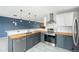 Well-lit kitchen with stainless steel appliances, butcher block countertops, and pendant lighting at 8755 W Cornell Ave # 14-5, Lakewood, CO 80227