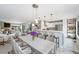 Bright living room featuring an open floor plan that connects to a modern kitchen with stainless steel appliances at 8755 W Cornell Ave # 14-5, Lakewood, CO 80227