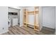 Convenient laundry room featuring wood flooring and built-in shelving at 8755 W Cornell Ave # 14-5, Lakewood, CO 80227