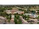 Aerial view showcases a community center with a pool and surrounding greenery at 9687 Timbervale Ct, Highlands Ranch, CO 80129