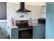 Modern kitchen features sleek appliances, stylish backsplash, and vibrant blue cabinetry at 9687 Timbervale Ct, Highlands Ranch, CO 80129