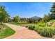 Scenic park view with a gazebo and landscaped pathway, perfect for relaxation at 9687 Timbervale Ct, Highlands Ranch, CO 80129