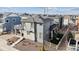 Aerial view of a modern home with manicured yard and inviting porch at 8403 Rush Creek Ave, Littleton, CO 80125