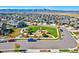 Community aerial view featuring parks, playgrounds, and landscaping, nestled against mountain scenery at 8403 Rush Creek Ave, Littleton, CO 80125