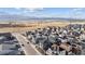 Aerial view of a residential community with mountain views and modern homes at 8403 Rush Creek Ave, Littleton, CO 80125