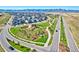 Community aerial view featuring well-manicured green spaces, wide roads, and mountain views at 8403 Rush Creek Ave, Littleton, CO 80125