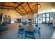 Spacious clubhouse with high ceilings, modern lighting, and fireplace feature at 8403 Rush Creek Ave, Littleton, CO 80125