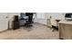 Home office with dual monitors, ergonomic chair and neutral carpet at 8403 Rush Creek Ave, Littleton, CO 80125