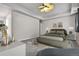 Comfortable bedroom featuring modern decor, a ceiling fan, and plush carpet at 2200 S University Blvd # 105, Denver, CO 80210