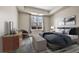 Bright bedroom with modern furniture and large window providing natural light at 2200 S University Blvd # 105, Denver, CO 80210