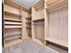 Organized walk-in closet with custom shelving and ample storage space at 2200 S University Blvd # 105, Denver, CO 80210