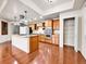 Spacious kitchen with a large island, stainless steel hood, and a walk in pantry at 2200 S University Blvd # 105, Denver, CO 80210
