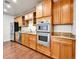 Well-equipped kitchen with stainless steel appliances, ample cabinet space, and granite countertops at 2200 S University Blvd # 105, Denver, CO 80210