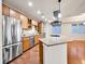 Bright kitchen featuring stainless steel appliances, custom cabinets, and a granite island at 2200 S University Blvd # 105, Denver, CO 80210