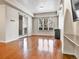 Spacious living room with hardwood floors, natural light, and access to a balcony at 2200 S University Blvd # 105, Denver, CO 80210