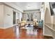 Inviting living room with wood floors, natural light, and comfortable seating at 2200 S University Blvd # 105, Denver, CO 80210