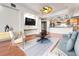 Open living space with a modern kitchen view, hardwood floors, and neutral decor at 2200 S University Blvd # 105, Denver, CO 80210