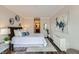 Cozy bedroom with decorative wall art and ensuite bathroom access at 1050 N Corona St # 304, Denver, CO 80218