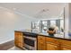 Modern kitchen boasts granite countertops, wooden cabinets, and stainless steel appliances at 1050 N Corona St # 304, Denver, CO 80218