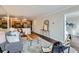 The cozy living room features hardwood floors, comfortable seating, and a mirrored wall at 1050 N Corona St # 304, Denver, CO 80218