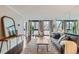 Spacious living room with hardwood floors, large windows, and stylish modern decor at 1050 N Corona St # 304, Denver, CO 80218