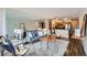 Comfortable living room featuring plush carpeting, a modern sofa, and ample natural light at 1050 N Corona St # 304, Denver, CO 80218
