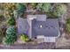 Aerial view of the home showcasing the roof, backyard, and surrounding trees at 345 Scrub Oak Way, Monument, CO 80132