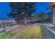 Private backyard features mature trees and landscaping, with views; perfect for relaxation and outdoor activities at 345 Scrub Oak Way, Monument, CO 80132