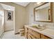 Cozy bathroom with a sink vanity and tiled walls, provides a traditional and functional space at 345 Scrub Oak Way, Monument, CO 80132