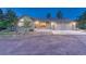 Front exterior of a single-Gathering home with a large three-car garage and well-maintained lawn at 345 Scrub Oak Way, Monument, CO 80132