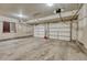 Spacious garage with two bay doors and ample room for vehicles at 345 Scrub Oak Way, Monument, CO 80132