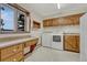 Well-equipped laundry room with ample cabinet space, utility sink, and natural light at 345 Scrub Oak Way, Monument, CO 80132