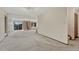 Open living room with neutral carpet, fireplace, mountain views from large sliding glass doors at 345 Scrub Oak Way, Monument, CO 80132