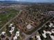 Aerial view of a neighborhood with houses, golf course and tree lined streets at 9400 E Iliff Ave # 411, Denver, CO 80231