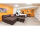 Spacious basement area with living space, bed and office furniture at 9400 E Iliff Ave # 411, Denver, CO 80231